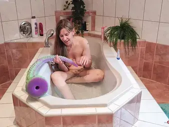 Watch this insatiable teen's solo session with a massive inked monster in the water