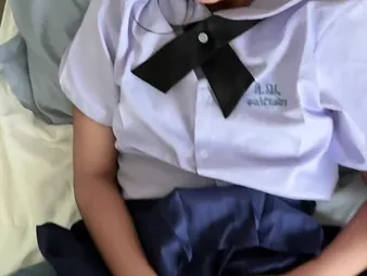 Watch Suwipha, a sexy Thai schoolgirl at hand establishing uniform, take a fast smart foreign a thick opalescent rod